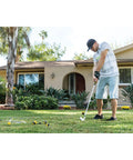 Man practicing golf swing with Dope Limited-Flight Practice Impact Golf Balls 12-Pack Yellow in front yard