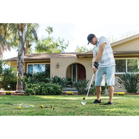 Man practicing golf swing with Dope Limited-Flight Practice Impact Golf Balls 12-Pack Yellow in front yard