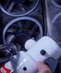 Hand using Powerful Computer Duster and Cleaner for Electronics and Home Use, High Velocity Air Blower on computer fan