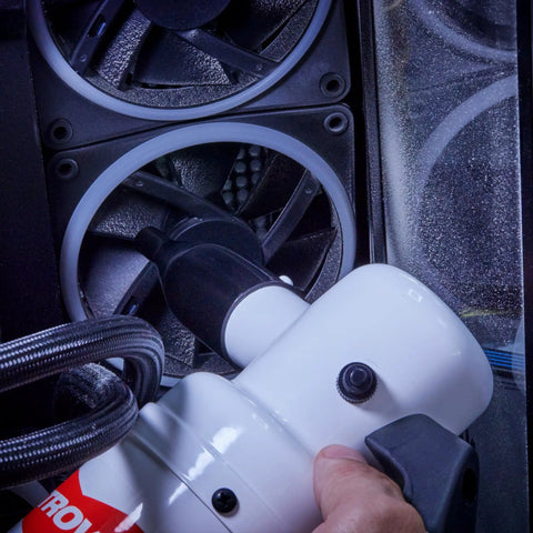 Hand using Powerful Computer Duster and Cleaner for Electronics and Home Use, High Velocity Air Blower on computer fan