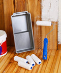4 Inch Foam Paint Roller Kit with 8 pack covers, frame, tray, liner on wood surface for smooth flat surface finishes