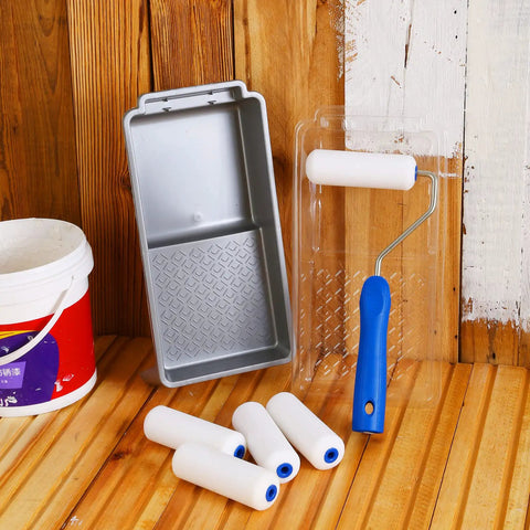 4 Inch Foam Paint Roller Kit with 8 pack covers, frame, tray, liner on wood surface for smooth flat surface finishes
