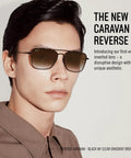 RBR0102S Caravan Reverse Sunglasses Gold Frame With Dark Green Lenses 58mm worn by person, showcasing unique design