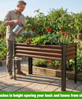 Man watering plants in 2 Pack Elevated Metal Raised Garden Bed With Legs 48 By 18 By 32 Inches Outdoor Planter Boxes