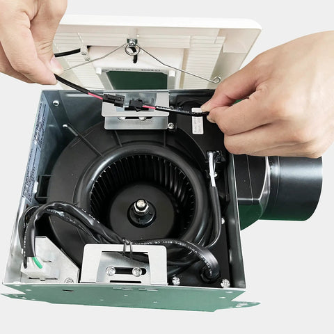 Hands installing internal wiring of Ultra Quiet Bathroom Vent Fan With LED Light 80 CFM 2.0 Sones No Attic Access Installation Easy Retrofit
