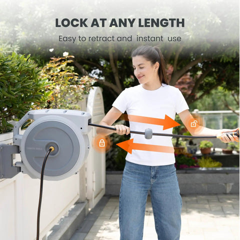 Person using Heavy Duty Retractable Garden Hose Reel 130 Ft Half Inch Hybrid Hose, Wall Mounted With Auto Rewind and Lock Any Length