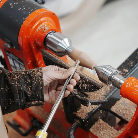 Person using lathe with Bottle Stopper Chuck For Lathe Mounting Three Eighths Inch By Sixteen TPI Stoppers And One Inch By Eight TPI Headstock Thread