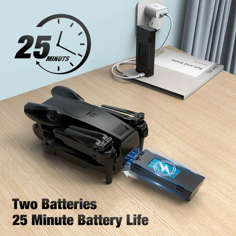 Foldable 1080P HD Camera Drone showing battery slot for two batteries, ideal for beginners and kids adults, charging setup on table.