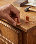 Hand installing 50 Pieces Tack On Drawer Glides Kit For Furniture L Shape Plastic Drawer Runners Replacement For Dresser Repair Vintage Brown Finish DIY Friendly Easy Alignment And Smooth Operation