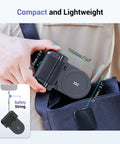 Person clipping Magnetic Phone Grip Camera Handle With Wireless Shutter Remote onto bag, showing dimensions and compact design.
