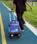 Person pulling a Foldable Aluminium Alloy Wheeled Backpack Trolley with Edge Guard Base and four spinner wheels on a path