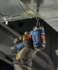 Worker using 12V Max Brushless 1 Quarter Inch Hex Two Speed Screwdriver Kit with Dual 2.0Ah Batteries for overhead assembly