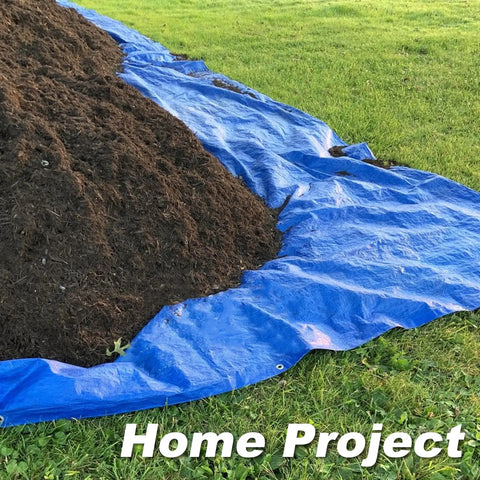 Heavy Duty Waterproof Tarp 8x10 Feet 2 Pack Blue Tarpaulin 8 Mil Thick with soil on grass for coverage