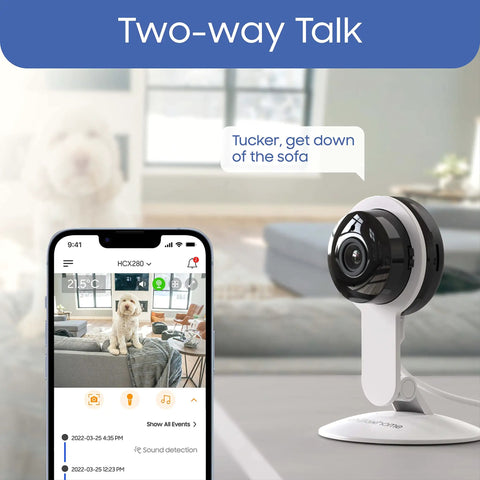Indoor Security Camera With Night Vision And 1080P HD, WiFi Home Surveillance on a table next to smartphone displaying app interface
