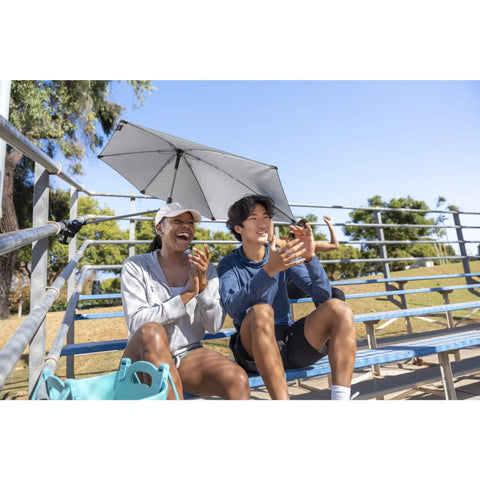 Versa Brella Midnight Blue Outdoor Shade Umbrella With Heavy Duty Clamp for chairs, in use on bleachers providing sun protection