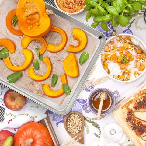 Stainless Steel Baking Sheet Set With Rack For Oven And Dishwasher Safe 19.6 Inch Two Pans And Two Racks featuring roasted pumpkin slices.