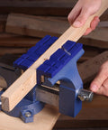 Six Inch Magnetic Vise Jaw Pads with TPU Soft Grips on bench clamp holding wood, dual sided V groove and flat surface visible