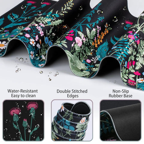 Close-up of the floral ergonomic Huge 4-In-1 XXL Desk Pad Set with water droplets, showcasing water-resistance and stitched edges.