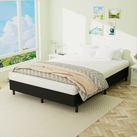Heavy Duty King Box Spring With Thick Fabric Cover And Reinforced Steel Frame Low Profile Bed Base in bright bedroom setting.