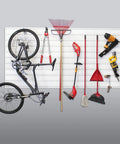 Heavy Duty PVC Slatwall Garage Organizer System 8 Ft By 4 Ft White Panels For A No-Fuss 32 Sq Ft Setup, Interlocking Slatwall Panels, Holds Up To 75 Lb Per Sq Ft, Includes Trims And Hardware For Stud Or Drywall Installation displaying organized tools and a bicycle.