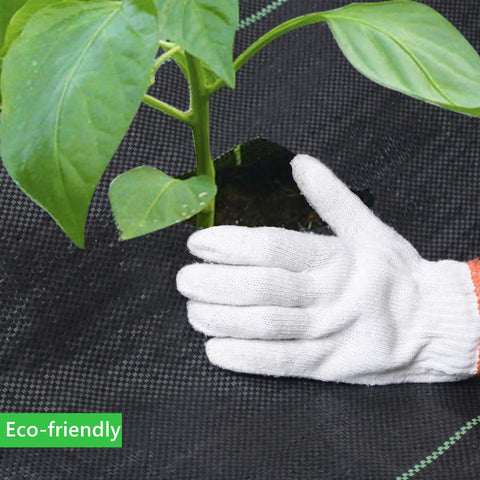 Gloved hand installing Heavy Duty Weed Barrier Fabric 3ft By 300ft 3.2oz Tear-Resistant Ground Cover around plant stem.