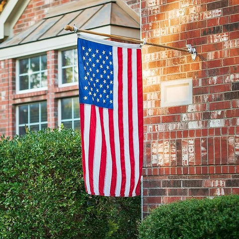 Tough As Nails 3x5 Ft Outdoor US Flag With Embroidered Stars, Tearproof Polyester, Fade Resistant, on brick exterior display.