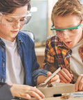 Hands-On Fossil Dig Kit For Kids Aged 8 To 12, Uncover 12 Real Fossils With An Illustrated Guide, A STEM Science Adventure For Boys And Girls, Easy To Use At Home, Educational, Engaging And Totally Fun; two kids dig fossils