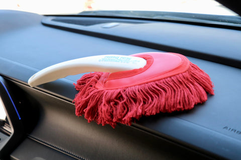 All In One Car Duster Detailing Kit with plastic handle resting on car dashboard, showing red mini dash duster, Model 62445.