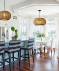 Large 22.83 Inch Rattan Boho Chandelier With Hand Woven Wicker, 4 Light Pendant Ceiling Fixture in a bright kitchen setting