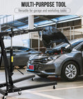 Tough Folding Engine Hoist And Hydraulic Cherry Picker Shop Crane 4400 Pound Lifting Capacity with car hood open in garage.