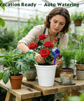 Woman using Six Pack Colorful Glass Plant Watering Globes For Indoor Pots And Outdoor Hanging Plants Self Watering Bulbs For Vacation Plant Care