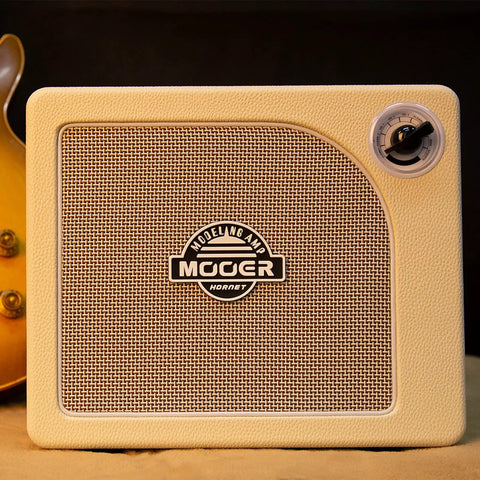 15W Practice Guitar Amp With 9 Digital Amp Models, 6.5 Inch Speaker, Bluetooth, close-up of the front speaker grille and brand logo