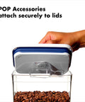 Hand holding clear lid of 0.4L Airtight Herb Storage Container For Spices And Pantry Staples, Stackable No Fuss Space Saving Design Keeps Dried Herbs Fresh, Clear Lid For Easy Visibility, showing secure attachment