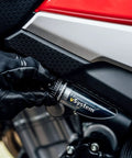 Vsystem Automatic Motorcycle Chain Lubrication System Easy Fit being installed on a motorcycle for smooth operation.