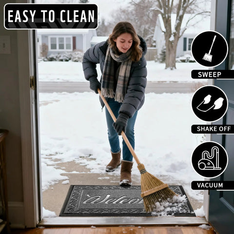 Tough As Nails Heavy Duty Welcome Mat For Home Entrance Indoor Outdoor Front Porch Door Mat 29.5x17 Waterproof Low Profile Dirt Trapper For Mud Dust Sand Patio Garage Office with woman sweeping snow outdoors