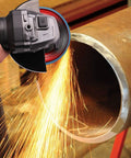 4 1/2 x 7/8 in flap disc on an angle grinder grinding stainless steel pipe with sparks