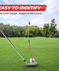 Golf Alignment Rods Swing Training Aid With Magnetic Base, 10 Inch Alignment Stick For On Course Practice, visible in grass with red color.