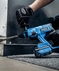 Worker using Beast Of A Cordless Rotary Hammer Drill With Brushless Motor SDS Plus 20V Battery on concrete corner