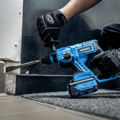 Worker using Beast Of A Cordless Rotary Hammer Drill With Brushless Motor SDS Plus 20V Battery on concrete corner