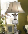 Granada Table Lamp With Crystal Base And Brushed Nickel Finish for a luxe living room vibe, placed on wooden side table.