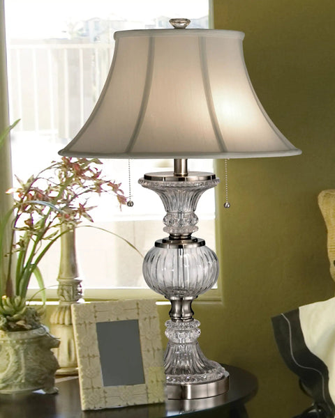 Granada Table Lamp With Crystal Base And Brushed Nickel Finish for a luxe living room vibe, placed on wooden side table.