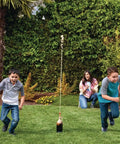 Extreme Geyser Tube Science Kit For Kids With Mentos And Soda Lab Experiment in garden with kids running from soda eruption