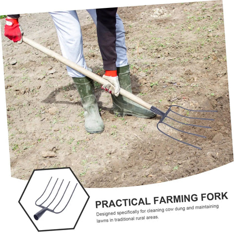 Person using Five Pronged Iron Manure Fork For Farming And Gardening, Heavy Duty Rake For Quick Lawn Cleanup And Manure Removal.