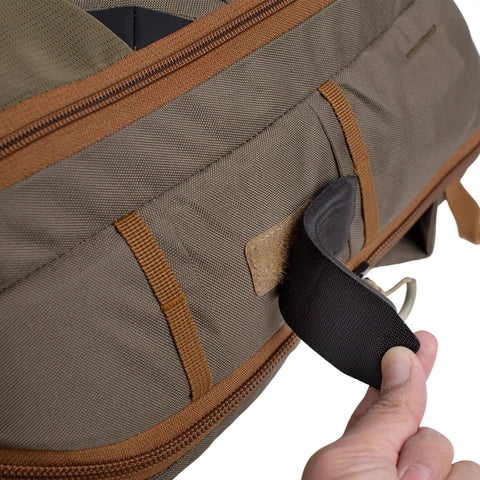 Close-up of Fly Fishing Sling Pack With Quick Access Chest Design showing olive green fabric and zipper detail.