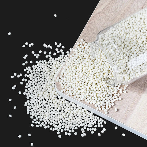 Heavy Duty Hot Melt Edge Banding Adhesive 11 Lb Pellets for Furniture cabinet sealing, shown in a spilled jar on wood.