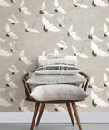 Halcyon Peel And Stick Grey And White Crane Pattern Wallpaper Removable Contact Paper For Walls behind a modern chair with cushions.
