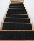 Wooden stairs with black No Slip Carpet Stair Treads For Wooden Steps, 16 Piece 8 By 30 Inch Self Adhesive Stair Runners installed