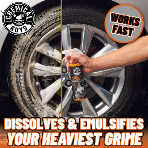 Hand using Orange Degreaser Spray For Engines And More Heavy Duty All Purpose Cleaner Pro Strength Breaks Down Grease Oil And Grime For A Deep Clean Of Engines Tires Undercarriages And Tools 16 Oz on car wheel