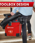 Person carrying 5 Gallon Wall Mount Wet Dry Vacuum With Remote Control Handle, 5 Peak HP Power, on stairs