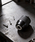 Keyless Drill Chuck 2-13mm With 1/2-20UNF Thread Quick Change For Power Tools Carbon Steel Body and Alloy Steel Jaws on workbench